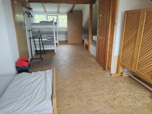 A room with a bunk bed, a wooden wardrobe, and a ladder. - Budget Rooms (Sarajevo)