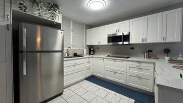 Fridge, microwave, stovetop, coffee/tea maker