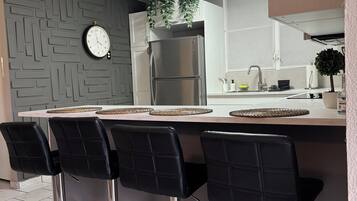 Fridge, microwave, stovetop, coffee/tea maker