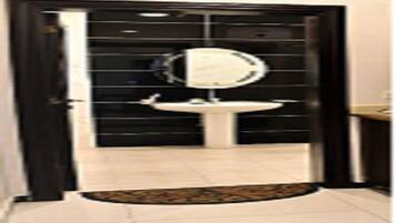 Bathtub, slippers, towels, soap