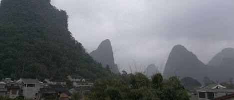 A mountainous landscape with traditional houses.
