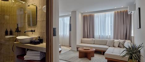 Suite Deluxe, vista a la ciudad | 1 habitación, sábanas de algodón egipcio y ropa de cama de alta calidad