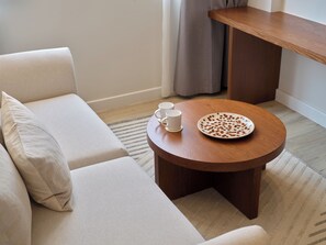 Junior Suite, City View | Living area | 40-inch Smart TV with digital channels