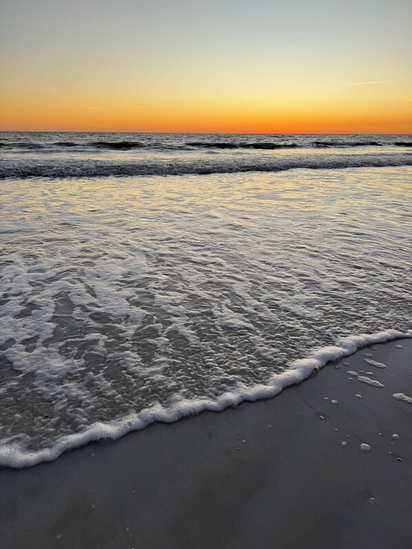 On the beach, sun loungers, beach towels