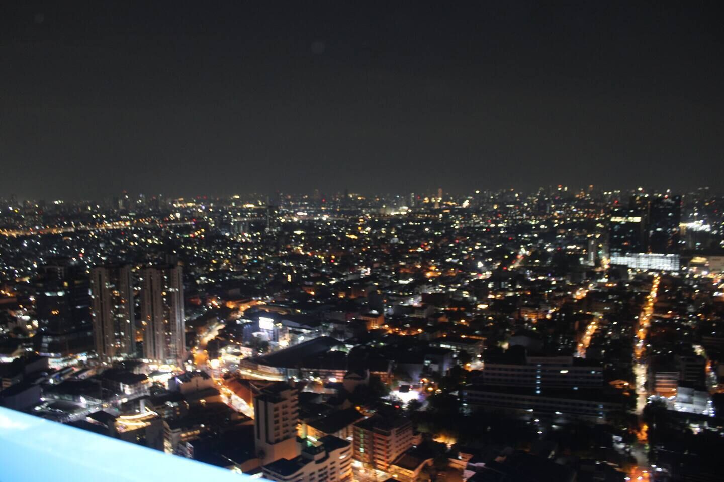 A nighttime cityscape with dense urban lighting.
