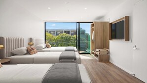 A modern bedroom with two beds, a large window, and a TV mounted on the wall. - Rambla @ Story House (Kangaroo Point)