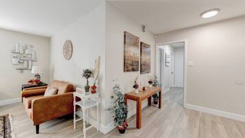 Smart TV, fireplace, books, computer monitors