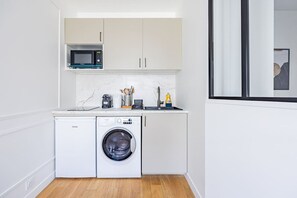 Microwave, stovetop, coffee/tea maker, cookware/dishes/utensils