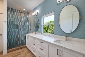Shower, hair dryer, towels, shampoo