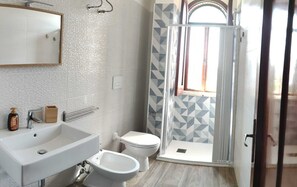 Shower, eco-friendly toiletries, hair dryer, bidet