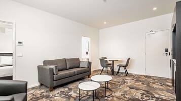 Apartment, 1 Bedroom | In-room safe, desk, laptop workspace, iron/ironing board