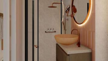 A modern bathroom with a large oval sink, a round mirror, and a shower area.