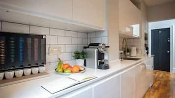 Fridge, microwave, coffee/tea maker, cookware/dishes/utensils