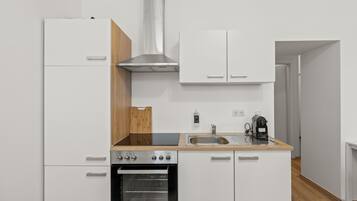 Departamento Confort, varias camas, para no fumadores | Cocina privada | Refrigerador, parrilla de estufa y cafetera de espresso