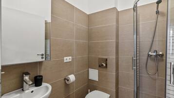 Comfort Apartment, Multiple Beds, Non Smoking | Bathroom | Shower, hair dryer, towels, soap