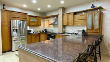 Villa | Private kitchen | Fridge, microwave, oven, stovetop