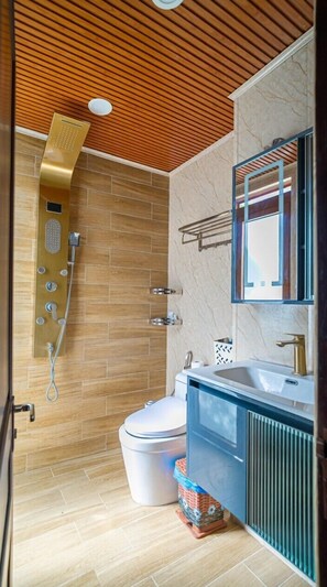 A modern bathroom with a wooden ceiling, a shower with multiple controls, a toilet, and a sink with a mirror. - Cozrum - Cozy Home Phú Yên (Tuy Hoa)