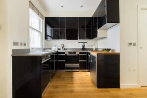 House | Private kitchen | Fridge, microwave, oven, stovetop - Designer Muji Home by Harrods (London)