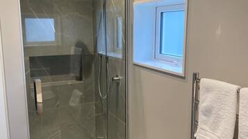 Shower, hair dryer, towels, soap
