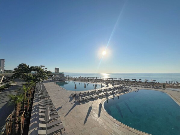 Indoor pool, seasonal outdoor pool, pool loungers, lifeguards on site