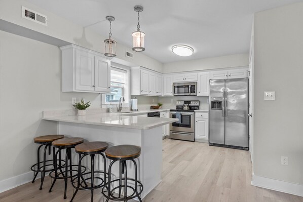 Fridge, stovetop, coffee/tea maker, highchair