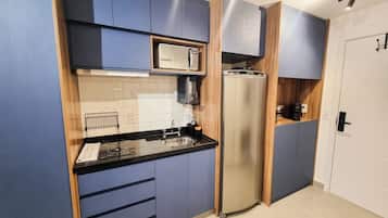 Microwave, stovetop, coffee/tea maker, electric kettle