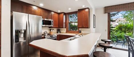 Condo, 2 Bedrooms | Private kitchen | Fridge, oven, coffee/tea maker, toaster