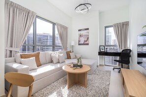 Deluxe Apartment, City View | Living area | 55-inch Smart TV with cable channels - Mystic - Bellevue Tower 1 (Dubai)