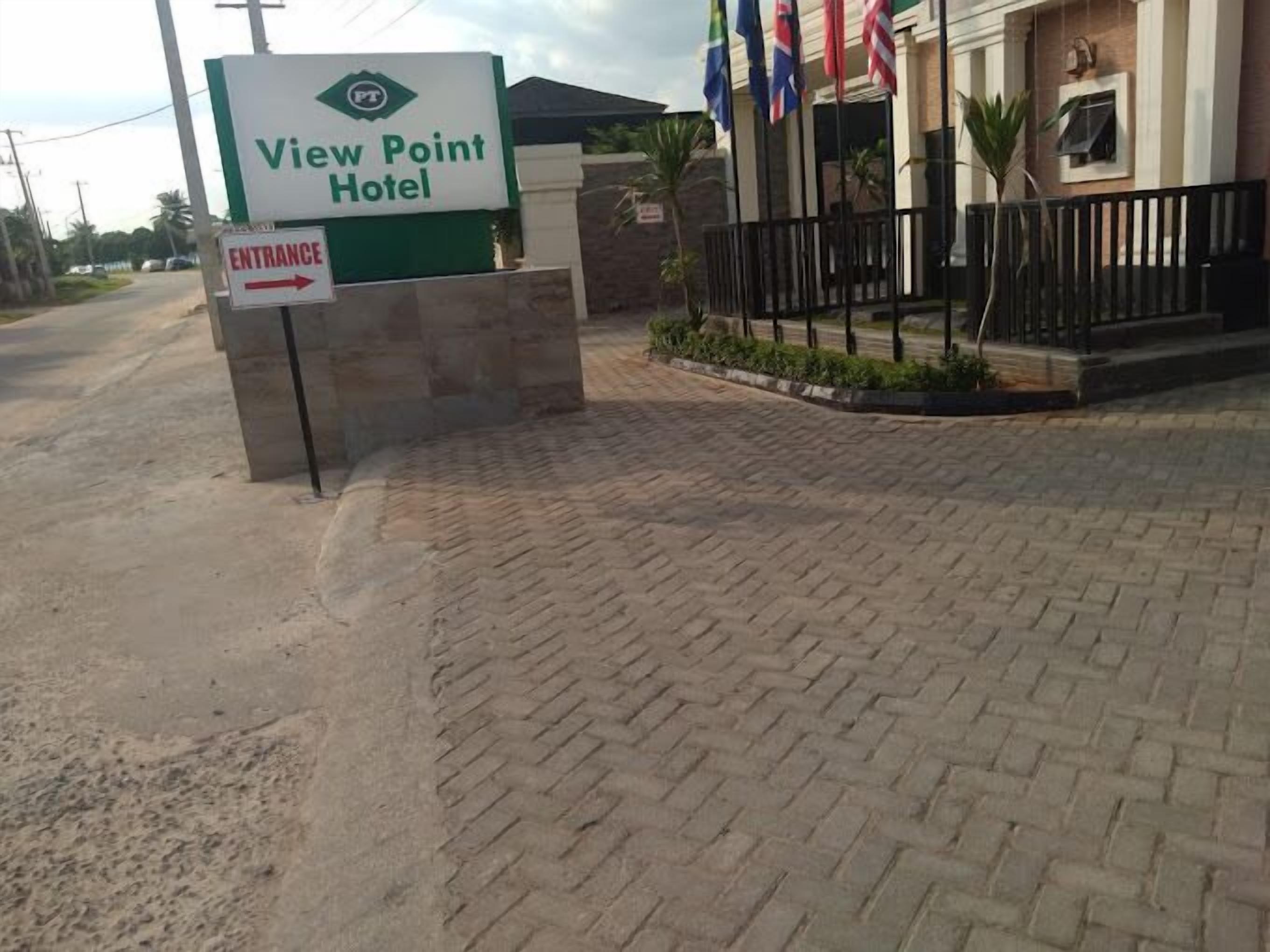 A sign for the View Point Hotel with an entrance arrow.