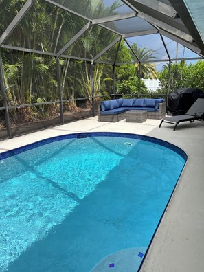 Outdoor pool, a heated pool - Tropical Escape- Heated Pool, Peloton, Pet friendly 3 bedroom/2 full bathrooms (Cape Coral)