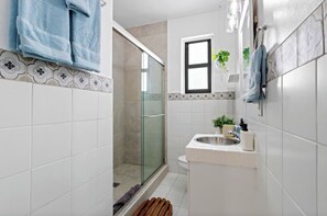 Shower, hair dryer, towels, soap