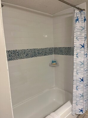 Hair dryer, towels, soap, shampoo
