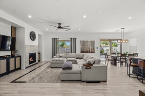 Smart TV, fireplace, books, offices