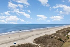 On the beach, sun loungers, beach towels