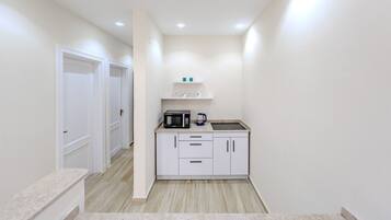 Fridge, cookware/dishes/utensils, dining tables