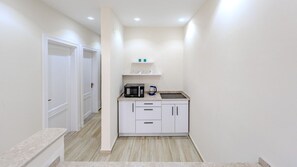 Fridge, cookware/dishes/utensils, dining tables