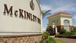 A building with a sign reading 'McKinley Park.' - Yuzons Bedspacer and Transient Home Staycation (Parañaque)
