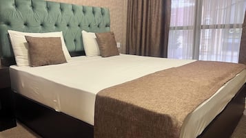 Basic Double Room, City View | In-room safe, laptop workspace, blackout drapes, soundproofing