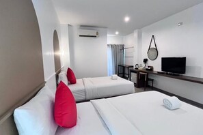 A hotel room with two beds, a desk, a television, and an air conditioning unit. - The S Design Hotel (Buriram City)