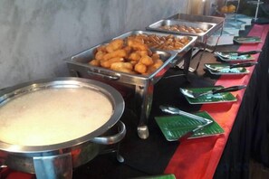 A buffet with various food items and serving utensils. - The S Design Hotel (Buriram City)