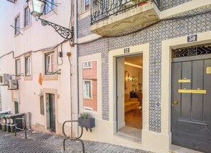 Traditional European-style building with a patterned tile facade and a welcoming entrance.