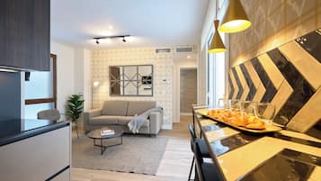 Basic Apartment | Living area | 40-inch Smart TV with digital channels, Netflix, streaming services