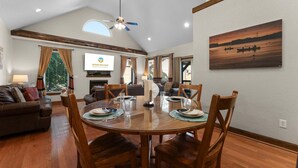 A dining area with a round table, chairs, and a ceiling fan. - Hickory Hideaway w/ Communal Pool Access (Hollister)