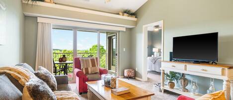Bright living space with sofa sleeper and TV
