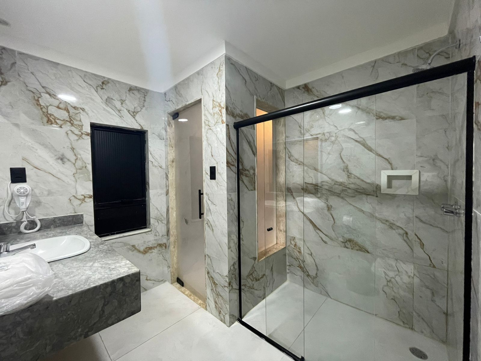 Standard Suite | Bathroom | Hair dryer, towels, soap, toilet paper