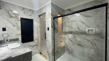 Standard Suite | Bathroom | Hair dryer, towels, soap, toilet paper