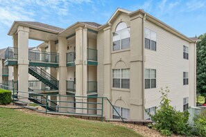 Stunning multi-story building with a central staircase and arched window.