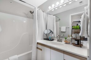 Shower, hair dryer, towels, shampoo