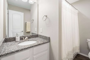 Shower, hair dryer, towels, shampoo