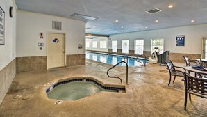 An indoor swimming pool area with a hot tub, seating, and a door marked "Open". - Stunning Water View – Pet Friendly, Indoor Pool (Branson)